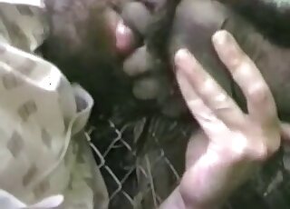 Sexy creature in the cage is receiving a very passionate handjob here