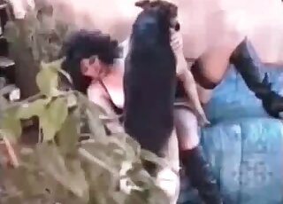 Curly MILF lays down on the bed to welcome her doggie to fuck her